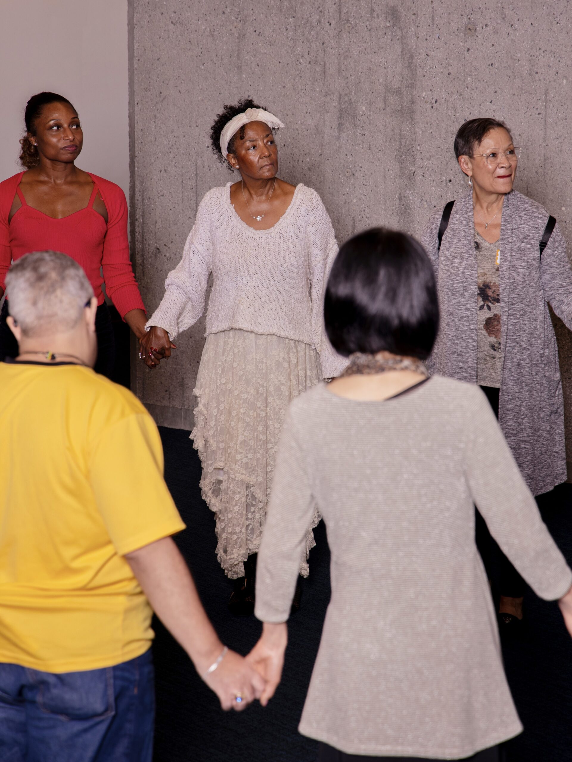 Home dancers in a group holding hands
